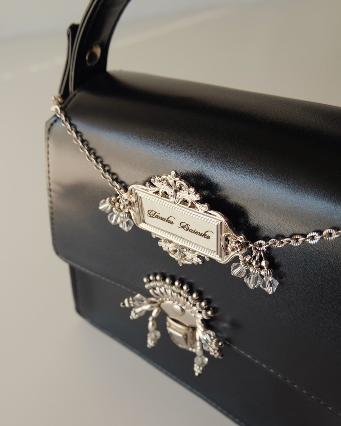 tanakadaisuke(タナカダイスケ)|バッグ|silver tag mini hand bag