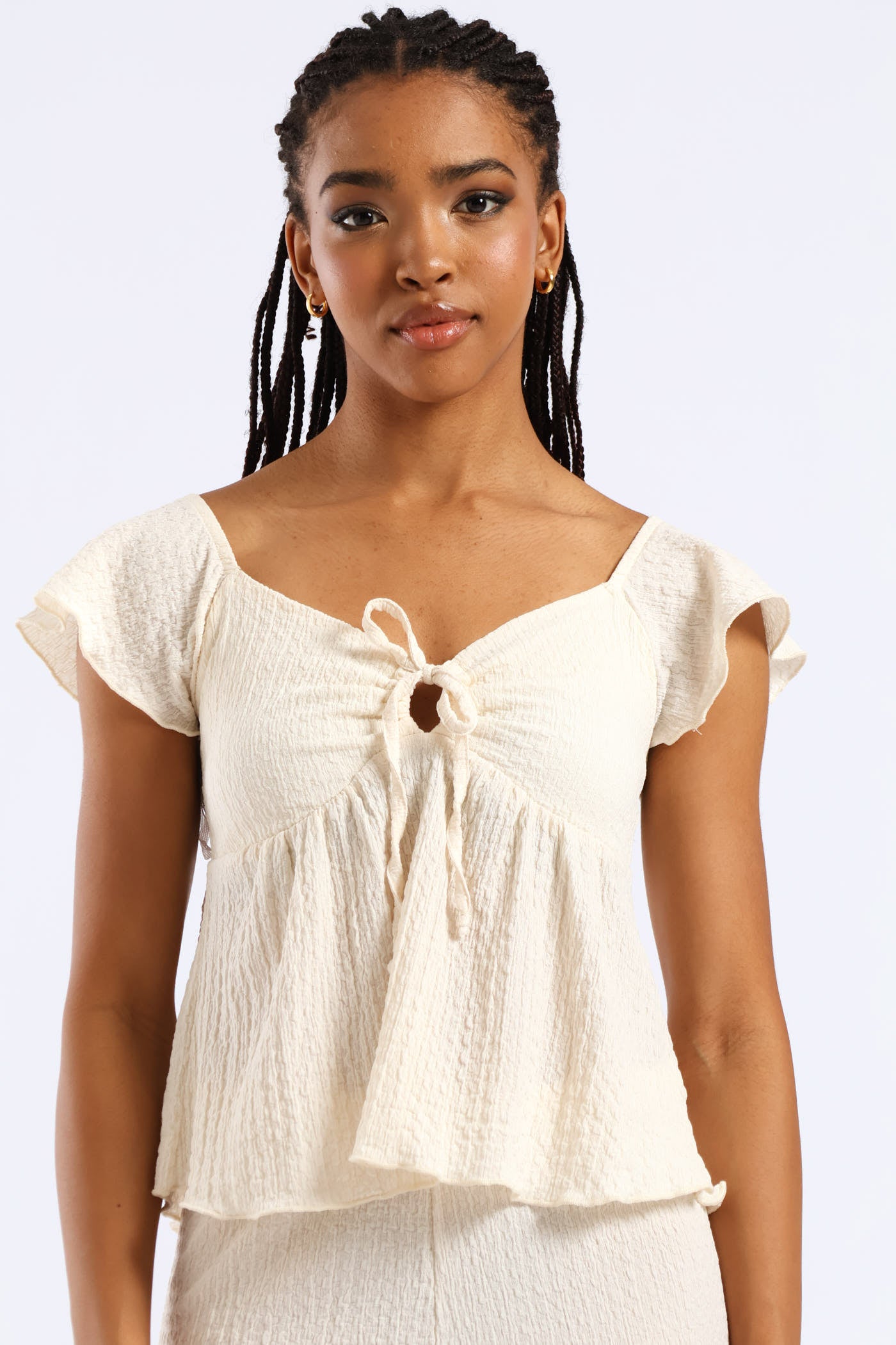 Crinkle Knit Peplum Top - Cream – LEGiT