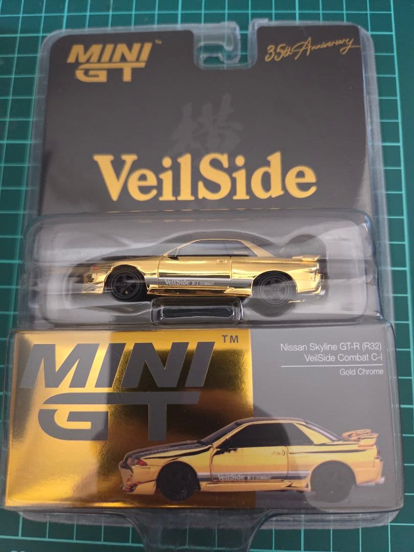 MINI GT Nissan Skyline GT-R (R32) 35周年記念 Mini GT Nissan Skyline GT-R R32 VeilSide Combat C-I Gold Chrome